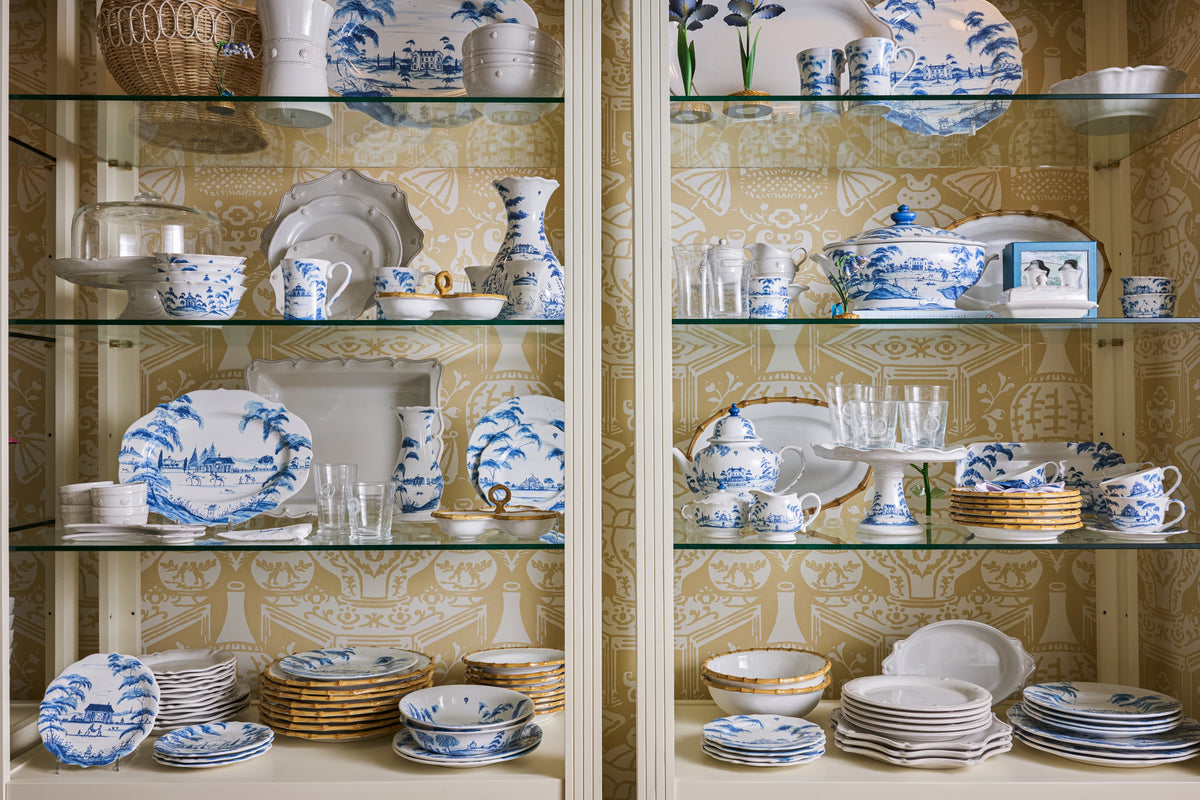 Blue-and-white dinnerware and serving pieces for a thoughtfully collected table.